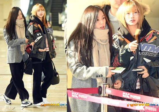 Hai thành viên Black Pink đều chọn kiểu quần ống suông, thoải mái khi di chuyển ở sân bay. Ji Soo giữ ấm bằng khăn quàng cổ to sụ.